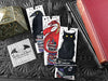 Set of bookmarks featuring my original pen and ink illustrations, front view alongside books with one of my branded cards. Made in the UK. Design and illustration © Nicola L Robinson | Teeth and Claws.