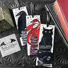 Set of bookmarks featuring my original pen and ink illustrations, front view alongside books with one of my branded cards. Made in the UK. Design and illustration © Nicola L Robinson | Teeth and Claws.