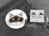 Birman Cat Coaster featuring my original pen and ink illustration of a Birman cat face, front view alongside one of my branded cards. Made in the UK. Design and illustration © Nicola L Robinson | Teeth and Claws.