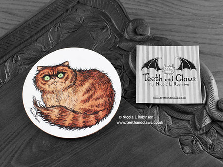 Persian Cat Coaster featuring my original pen and ink illustration of a ginger Persian cat, front view alongside one of my branded cards. Made in the UK. Design and illustration © Nicola L Robinson | Teeth and Claws.