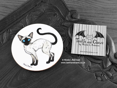 Siamese Cat Coaster featuring my original pen and ink illustration of a Siamese cat, front view alongside one of my branded cards. Made in the UK. Design and illustration © Nicola L Robinson | Teeth and Claws.