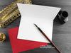 Cat love card, shown open and flat with blank inside, on a red envelope, alongside vintage Victorian pen and writing desk accessories. Design and illustration © Nicola L Robinson | Teeth and Claws