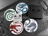 Set of four of my dragon coasters featuring my original pen and ink dragon illustrations, front view alongside a black gift box and card. Made in the UK. Design and illustration © Nicola L Robinson | Teeth and Claws.
