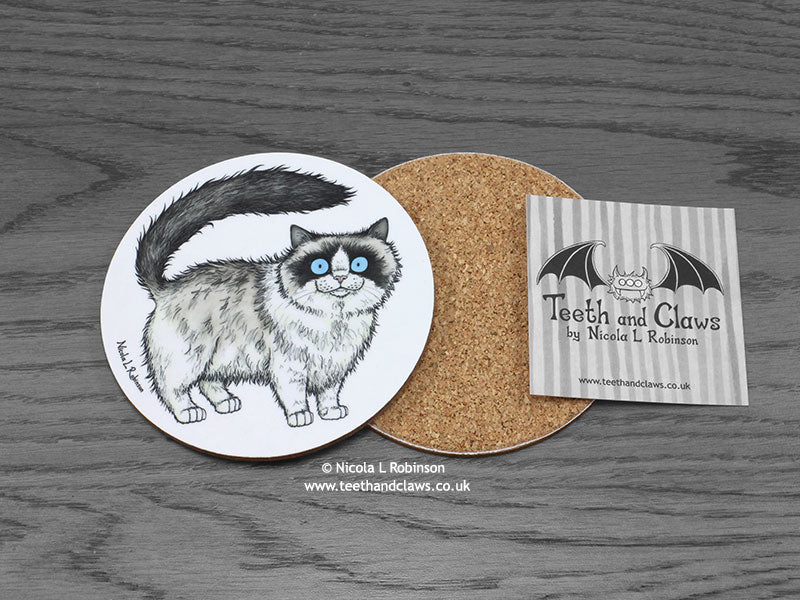 Ragdoll Cat Coaster featuring my original pen and ink illustration of a Ragdoll cat, back view showing the cork backing, alongside one of my branded cards. Made in the UK. Design and illustration © Nicola L Robinson | Teeth and Claws.